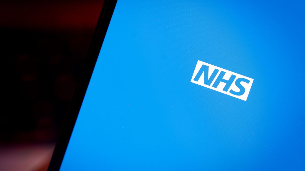 NHS logo displayed on a smartphone screen in white lettering on a blue background.